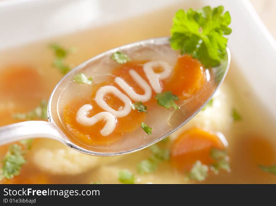 Noodle soup with dumplings and carrots