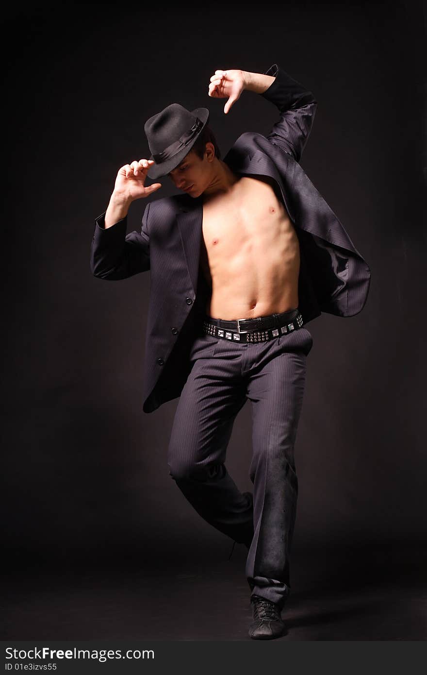 Stylish and young modern style dancer is posing