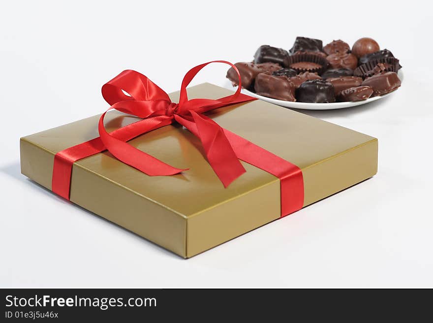 Gift box with red ribbon isolated on white