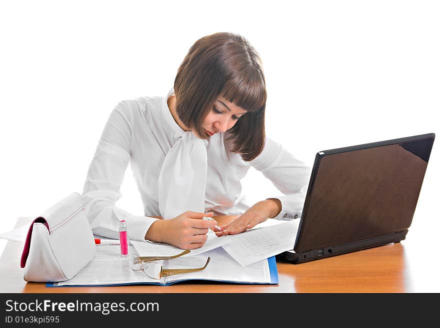 Girl working in an office that deals with foreign affairs. She paints nail varnish.