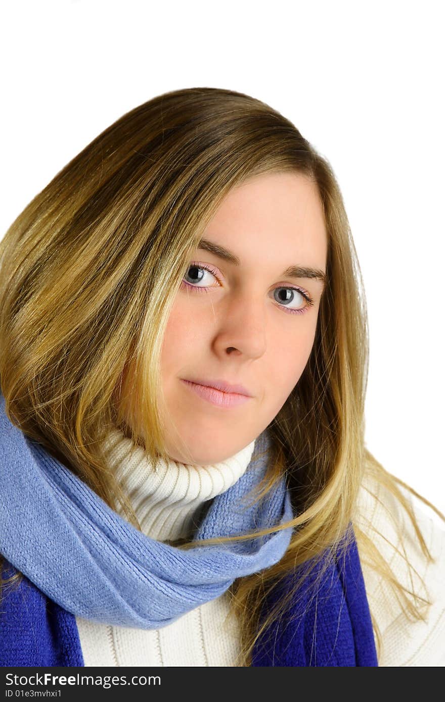 Attractive young blond woman with white turtleneck sweater and blue scarf. Attractive young blond woman with white turtleneck sweater and blue scarf.