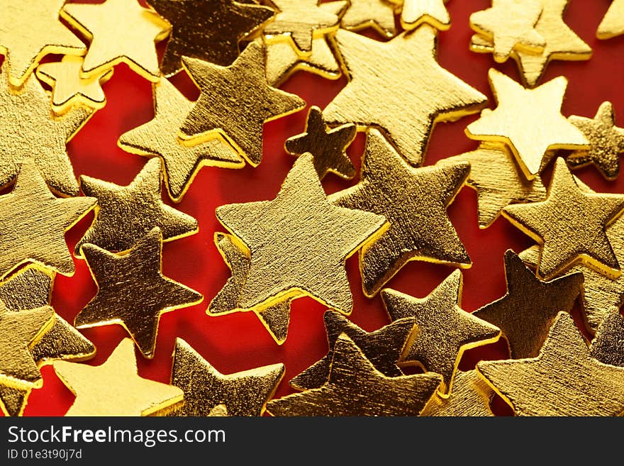 golden decoration with gold star over red background