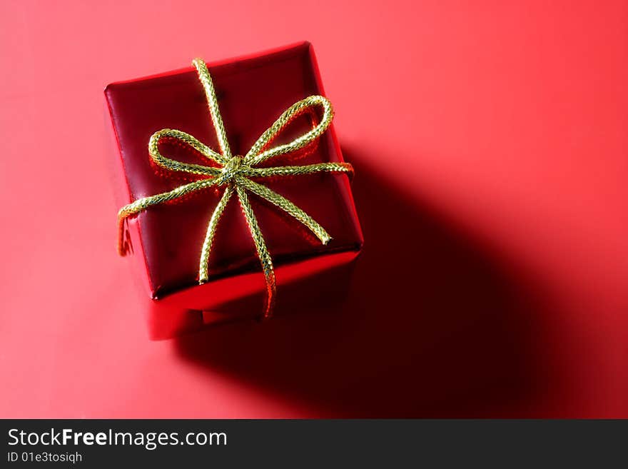 Christmas present, gift over red studio background