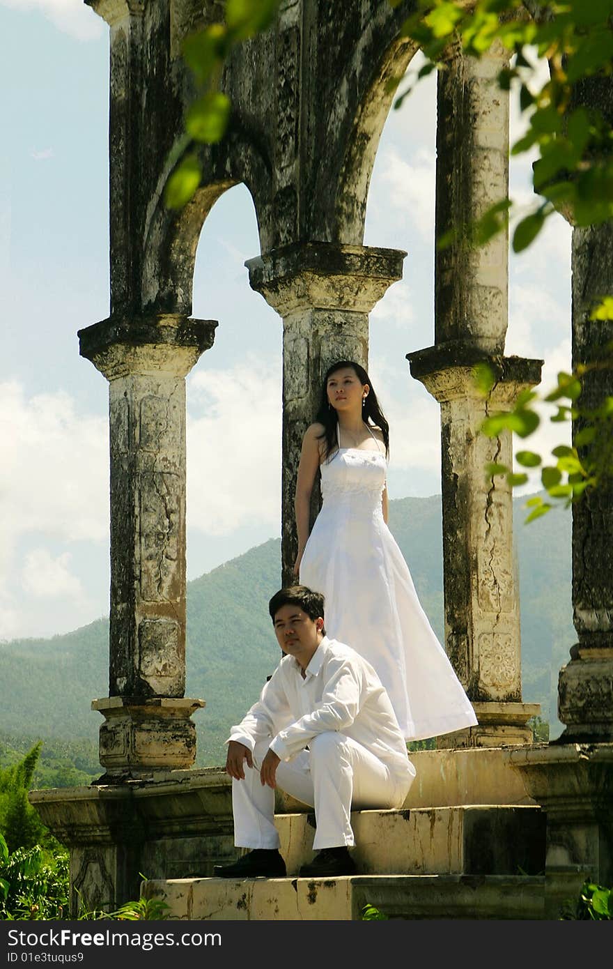 Couple in white in an old building. Couple in white in an old building