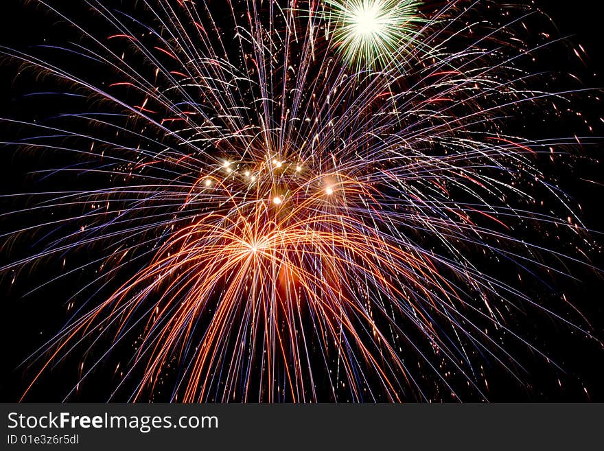 Bright colored fireworks on black background