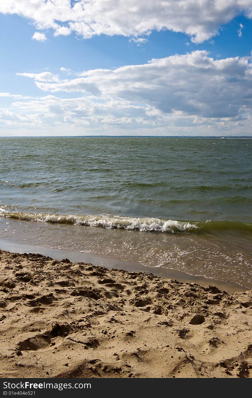 Wet send with waves and sky. Wet send with waves and sky