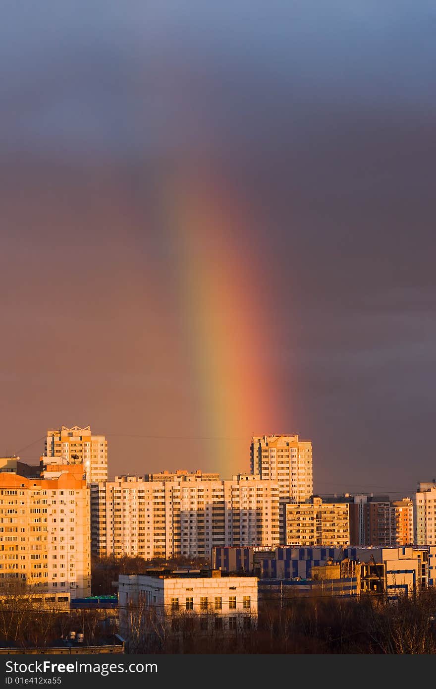 Big rainbow above city buildings. Big rainbow above city buildings