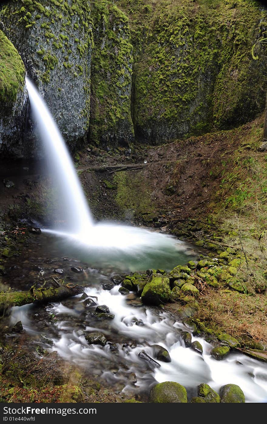 Beautiful water amid rocky terrain vertical composition. Beautiful water amid rocky terrain vertical composition