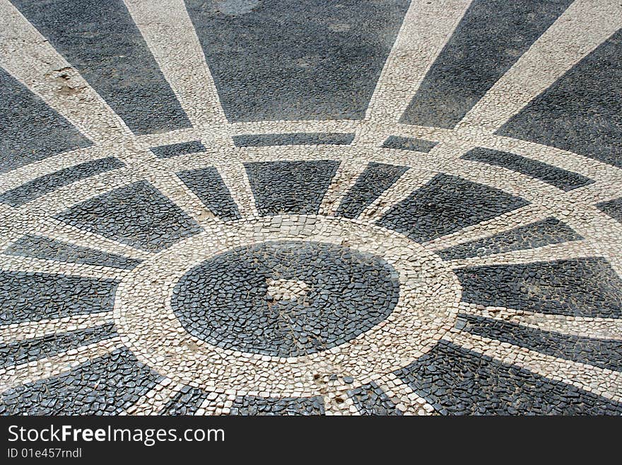 Black and white stones in lines and circle