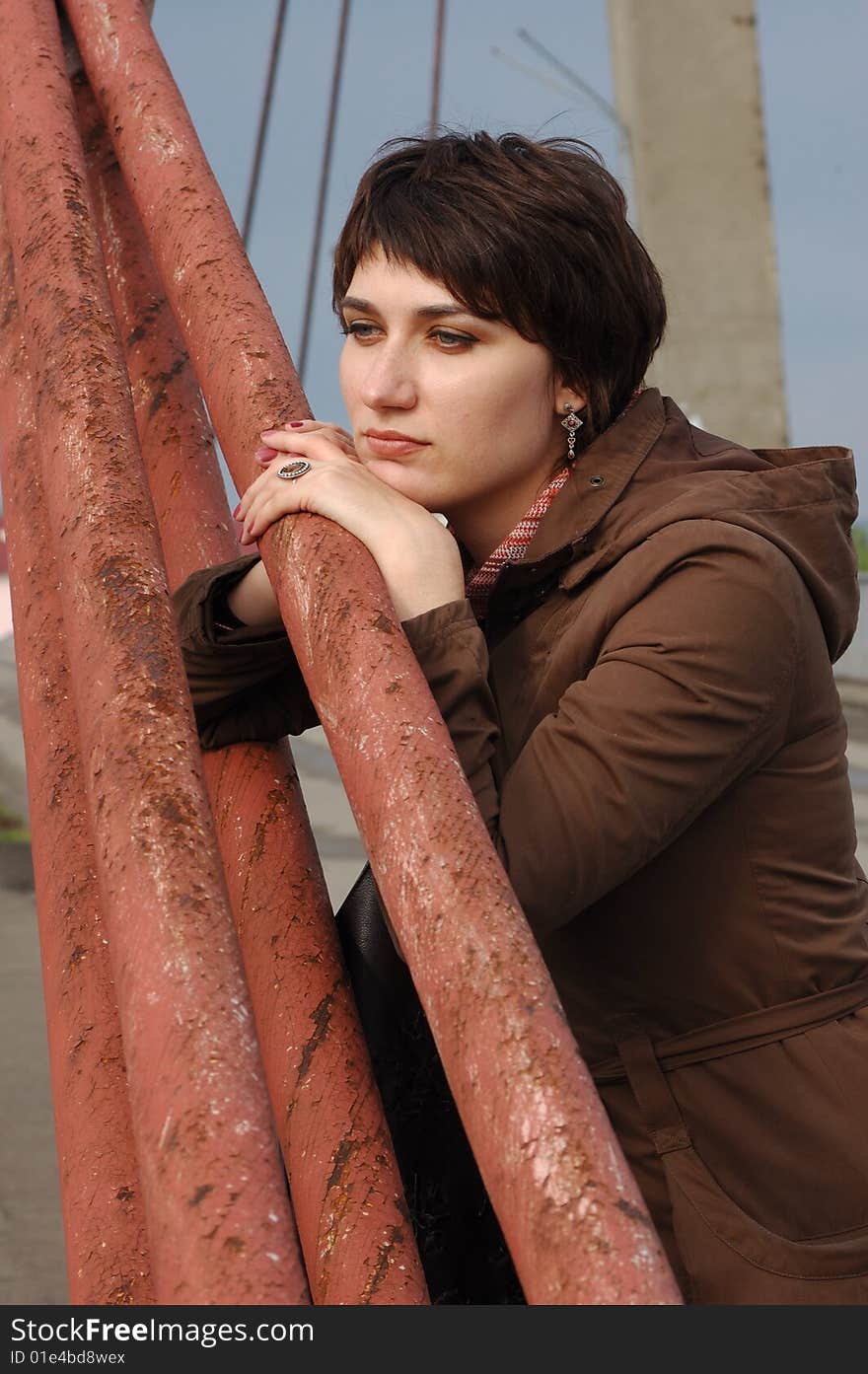 Pensive woman on the bridge