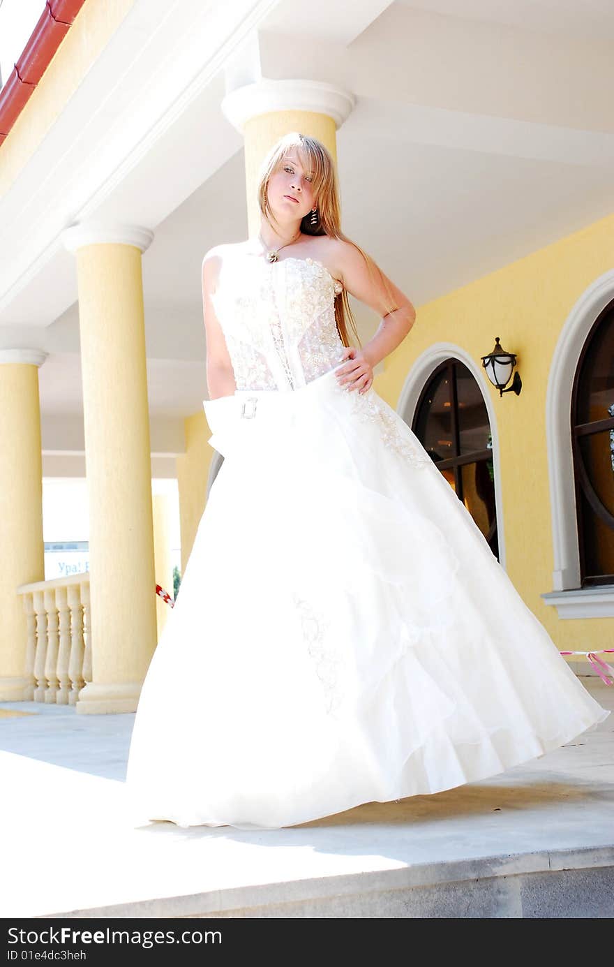 The happy girl in a wedding dress