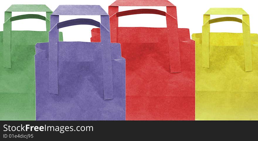 Shot of three coloured paper shopping bags on white. Shot of three coloured paper shopping bags on white