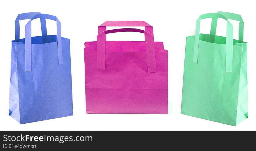 Shot of three coloured paper shopping bags on white. Shot of three coloured paper shopping bags on white