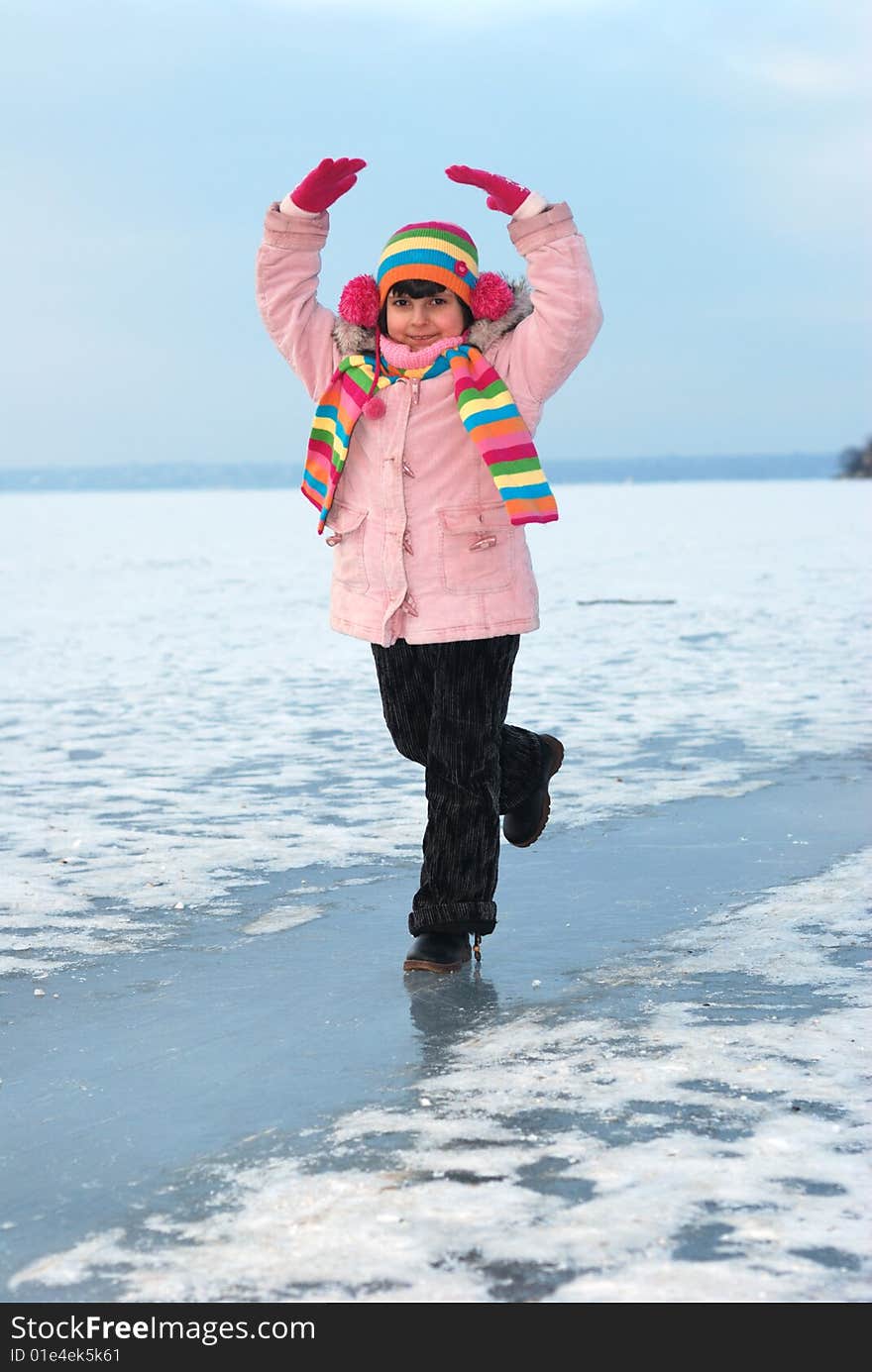 Dancing child on icy river