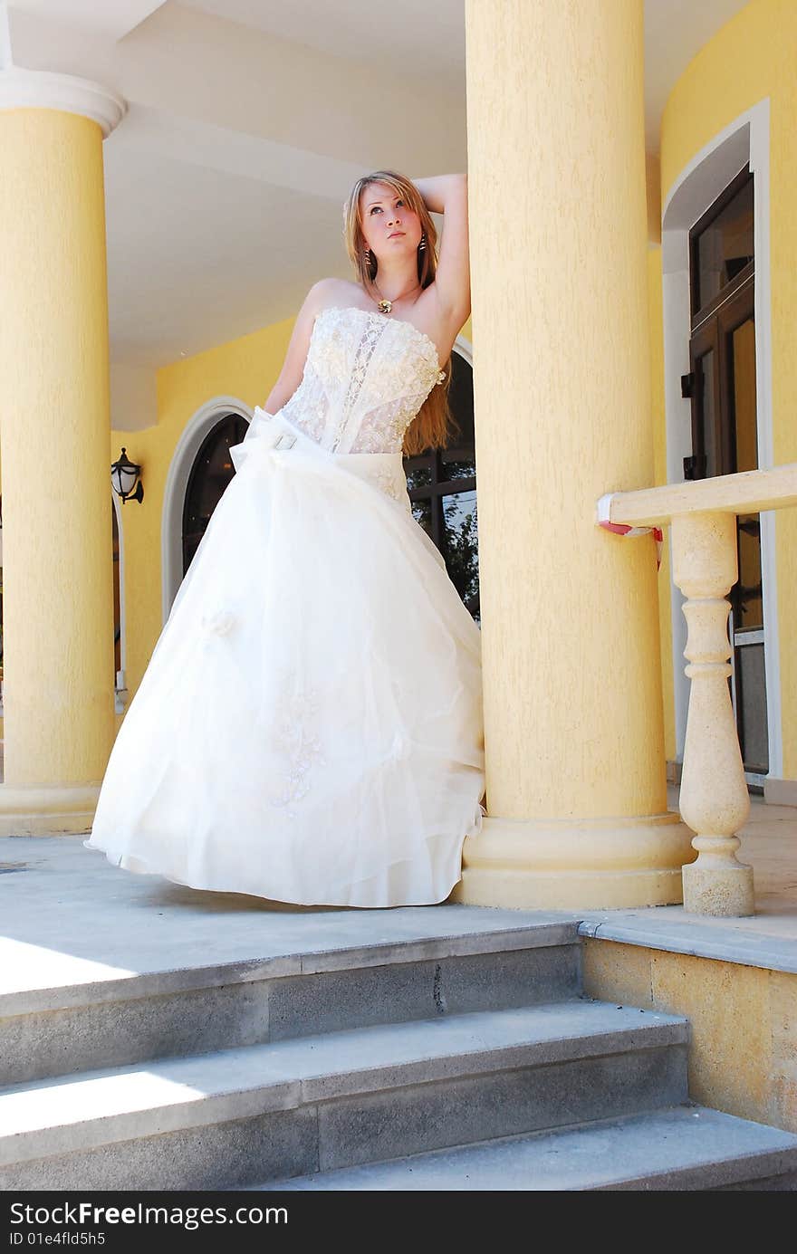 The happy girl in a wedding dress