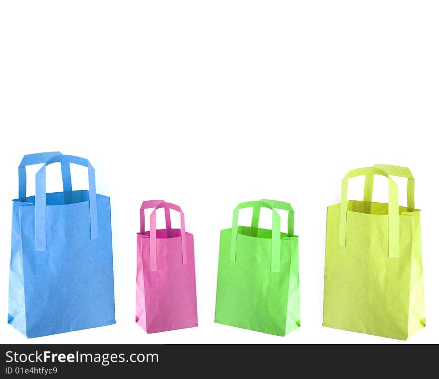 Shot of three coloured paper shopping bags on white. Shot of three coloured paper shopping bags on white