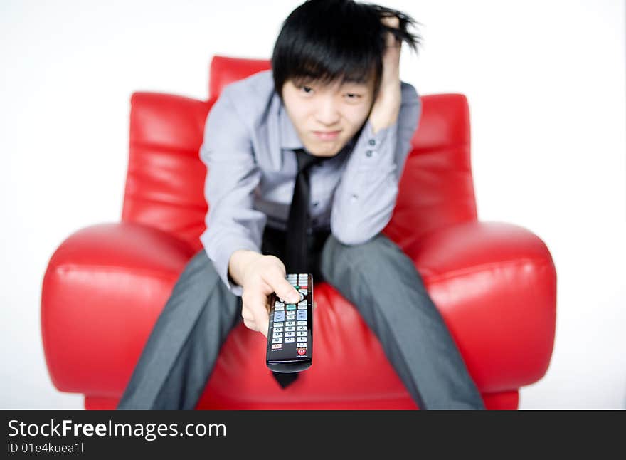 The Young Man In A Grey Shirt Watches TV