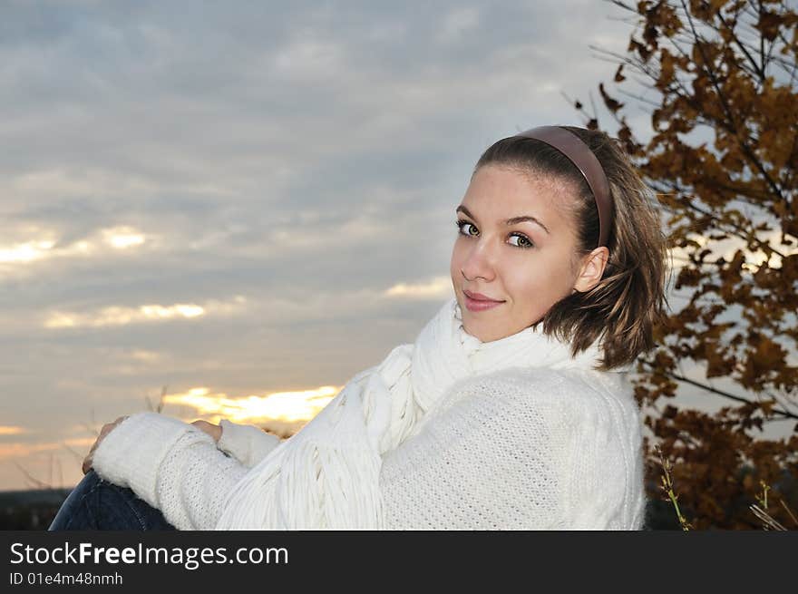 Portrait pretty girl on sunset background