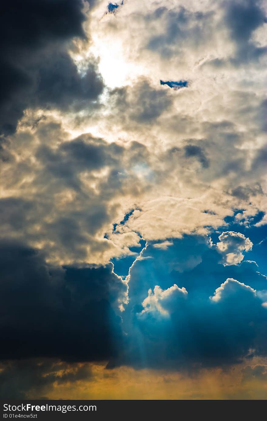 Cloudscape with sun ray shining through.