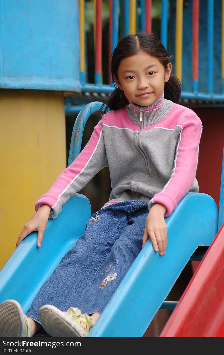 Girl  Play In Amusement Park