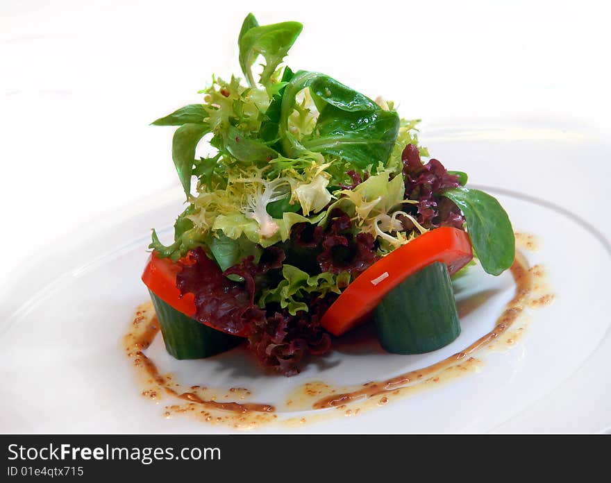 Vegetable salad on a white plate