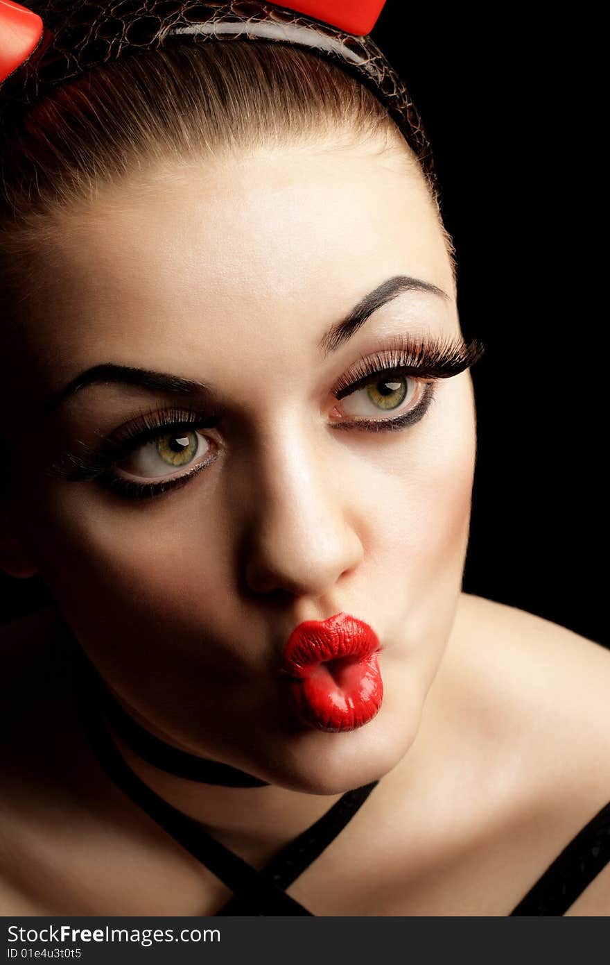 Green-eyes Girl with Red Lips over Black Background