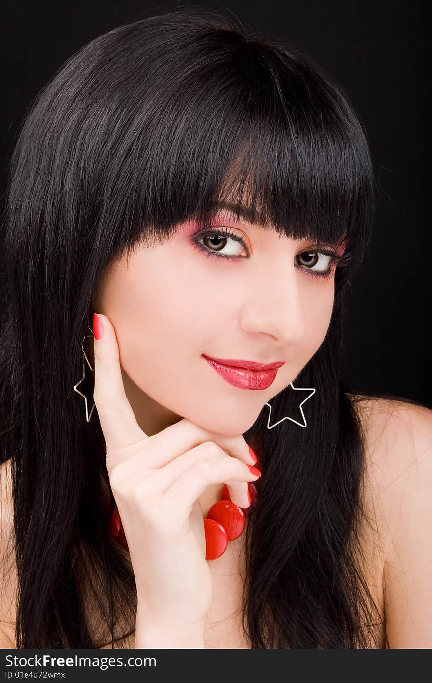 Portrait of the charming woman on black background