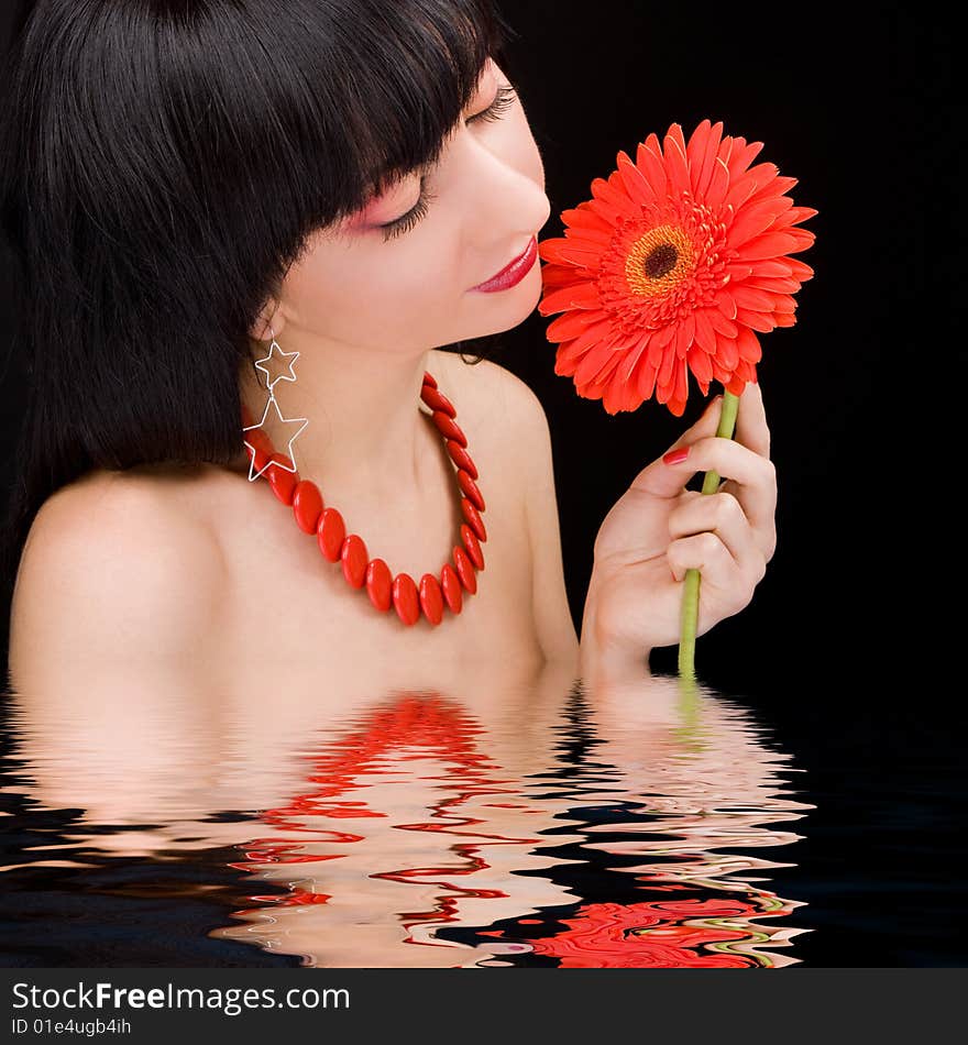 Young woman with red flower