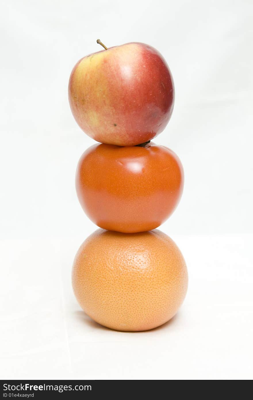 Apple, tomato and orange