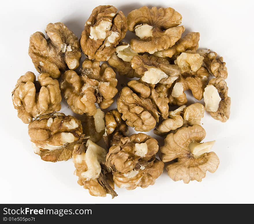 Group walnuts in brown pod without nutshell