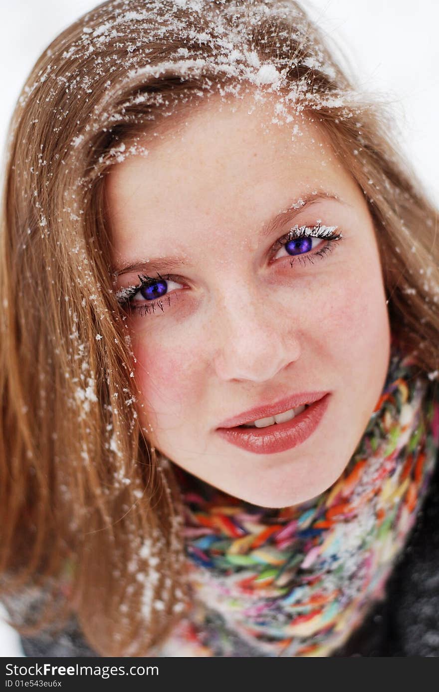 Beautiful young woman with snow on her hair. Beautiful young woman with snow on her hair