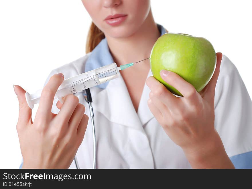 Nurse with syringe and apple