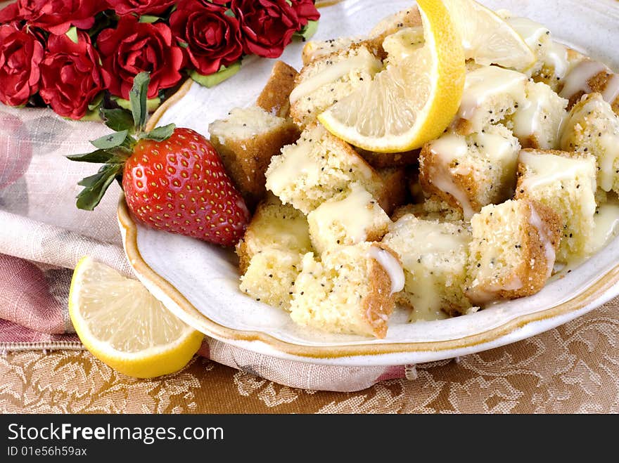 Lemon Poppy Seed Bread cut in cubes with glaze. Lemon Poppy Seed Bread cut in cubes with glaze