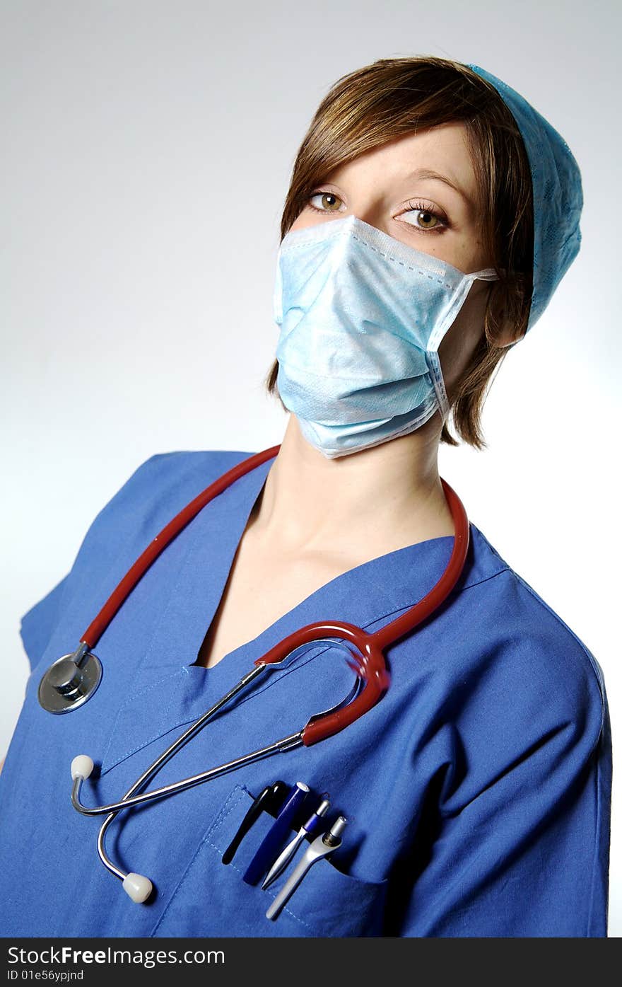 Nurse with mask and hat on a white blackground. Nurse with mask and hat on a white blackground