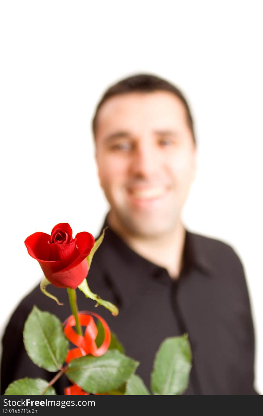 Young man giving a red rose to somebody. Young man giving a red rose to somebody