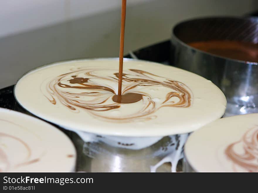 Pastry getting ready in stainless steel pans