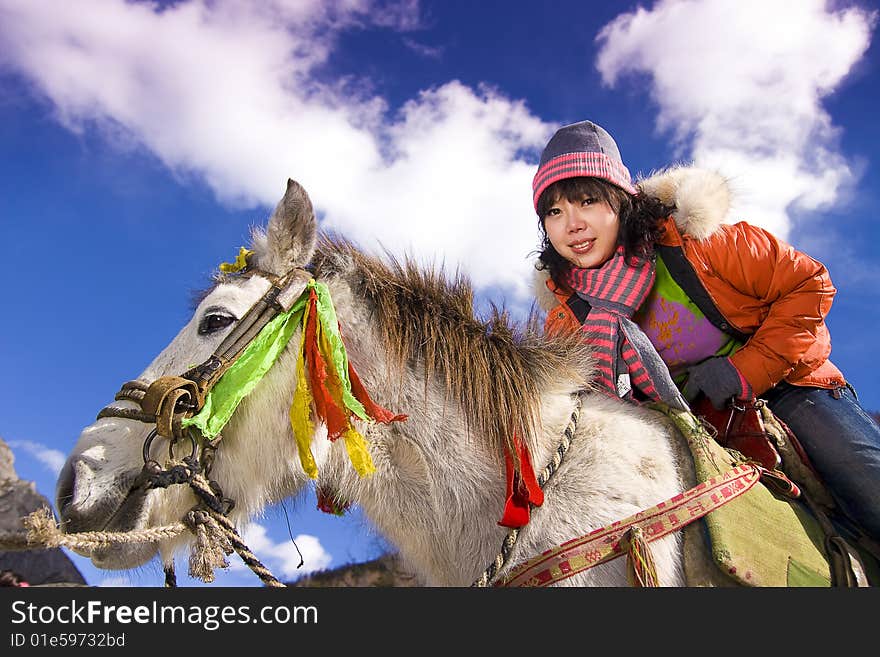 The girl rides a horse