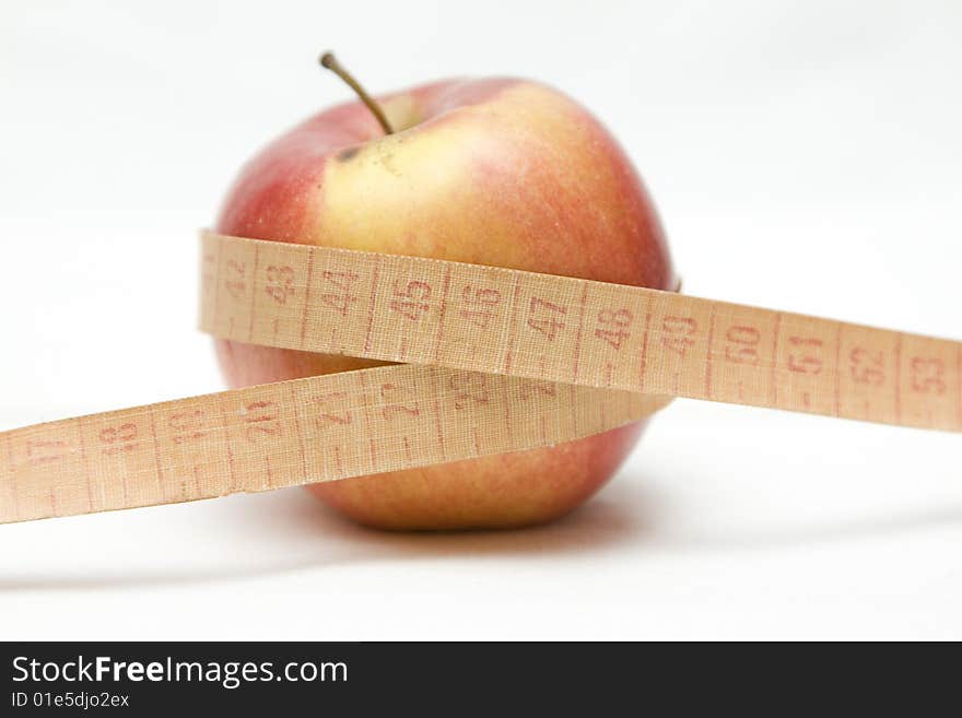 Apple with metre on not isolated background