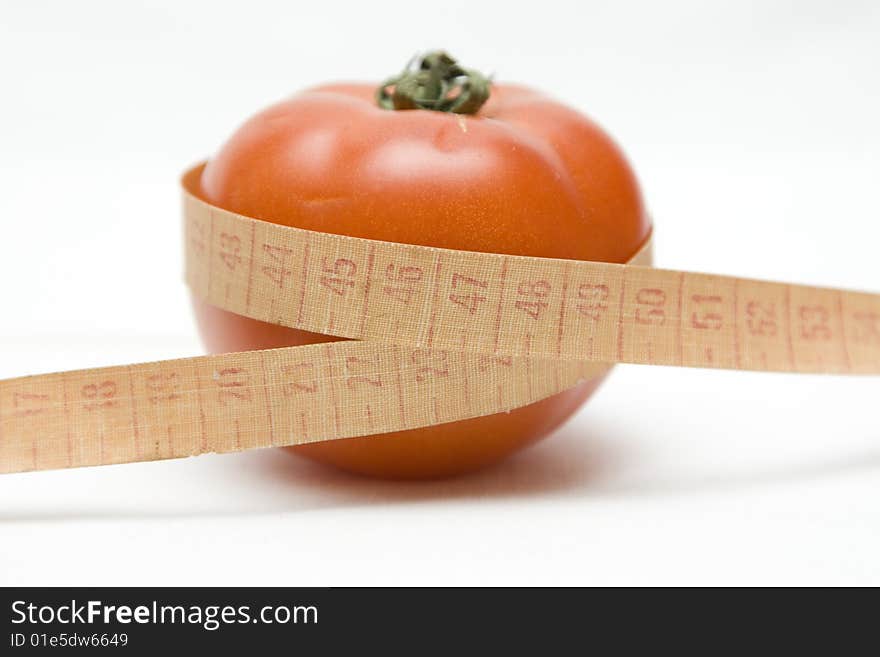 Tomato with metre on not isolated background
