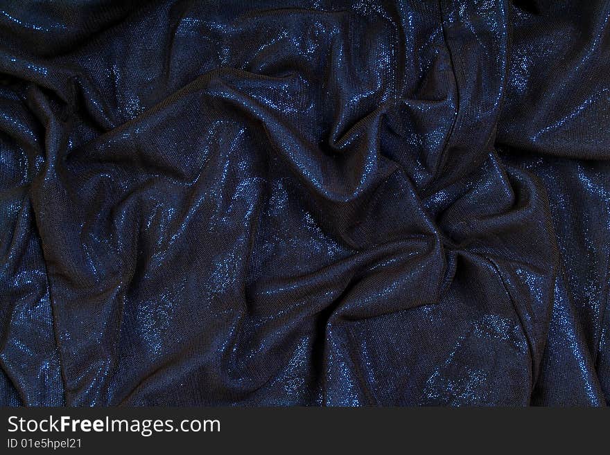 The crumpled dark blue fabric for a background