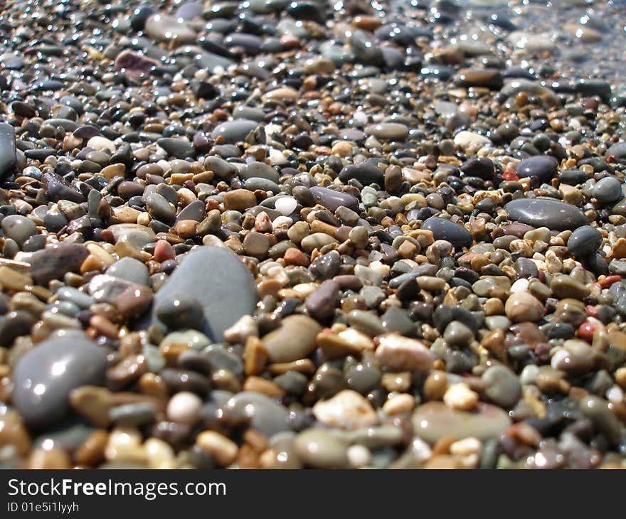 The beach is strewn with shingle. The beach is strewn with shingle