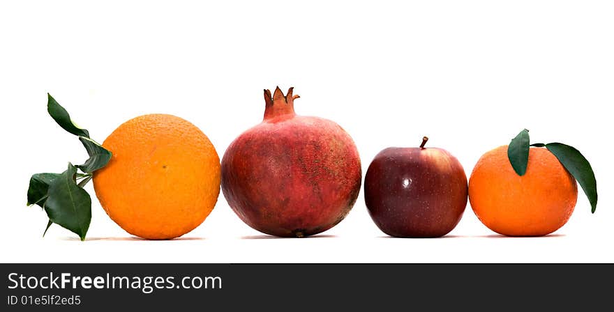 Pomegranate, orange, tangerine, and apple