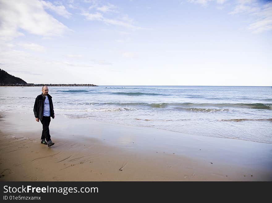 Man On The Beach. San Sebastian. Spain