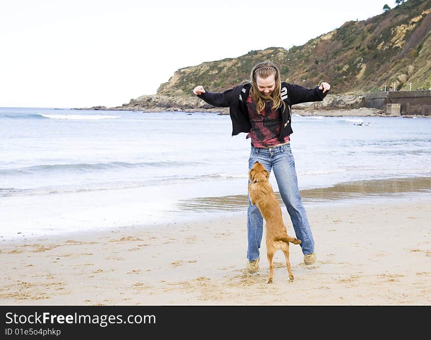 Woman With Dog On The Beach