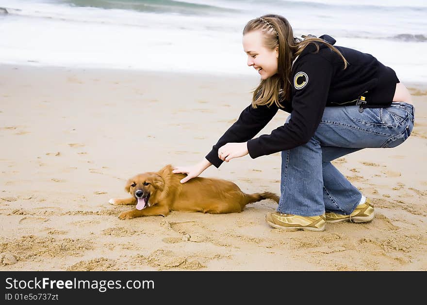 Woman With Dog Near The Ocean