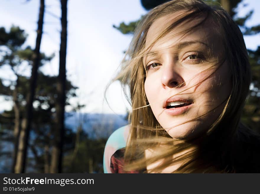 Pretty Woman Portrait On The Nature Background. Focus On The Lips