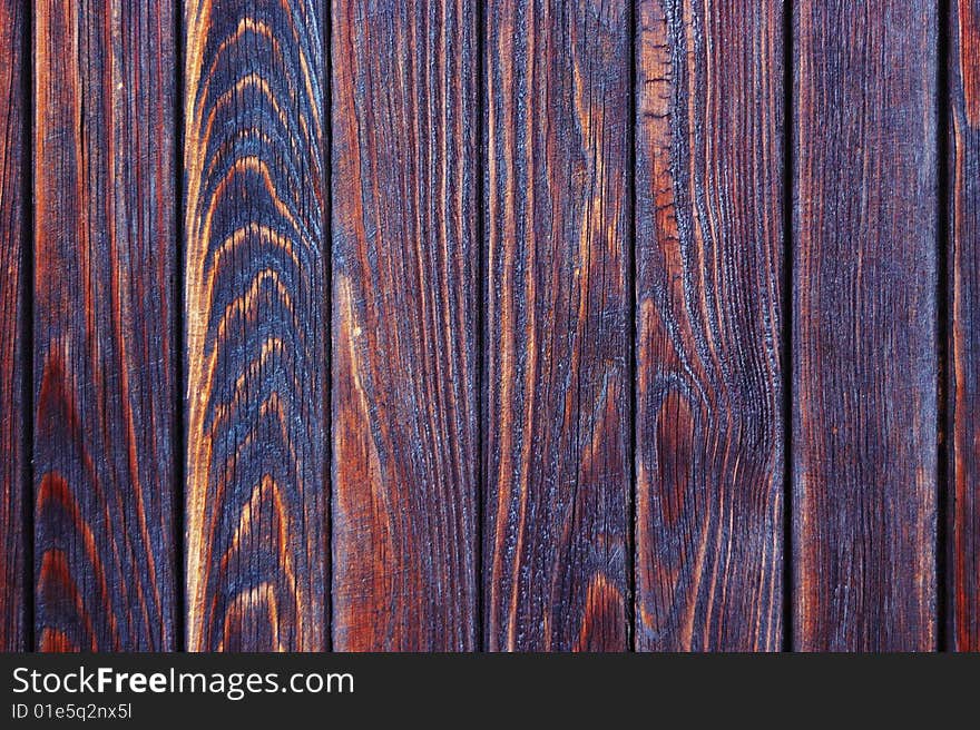 Rough burnt wooden paneling texture. Rough burnt wooden paneling texture