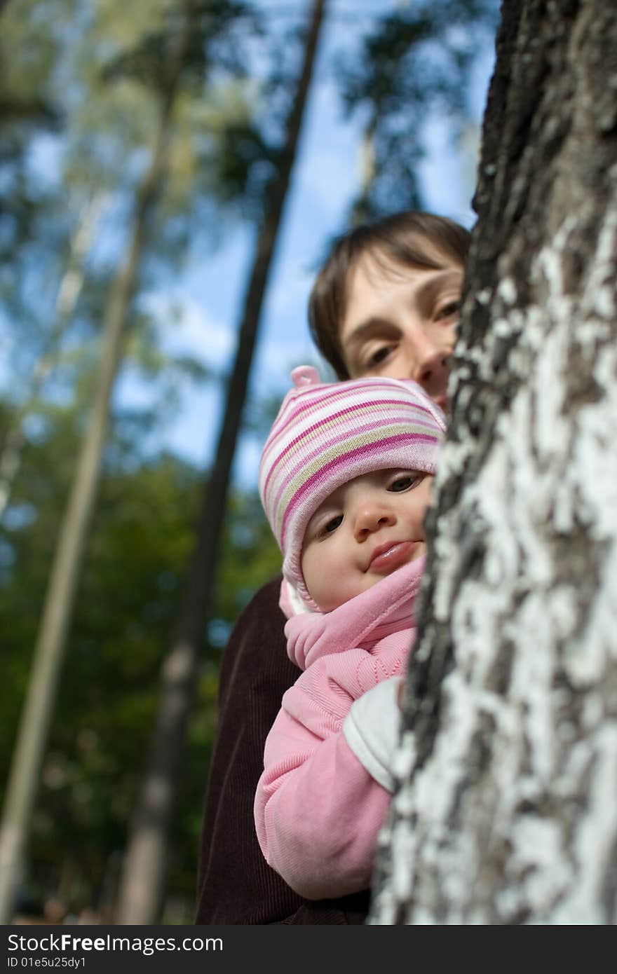 Baby with mom in the forest