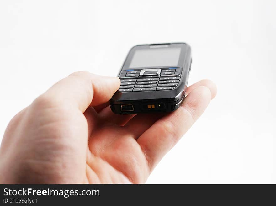 Mobile phone laying in hand on white background. Mobile phone laying in hand on white background