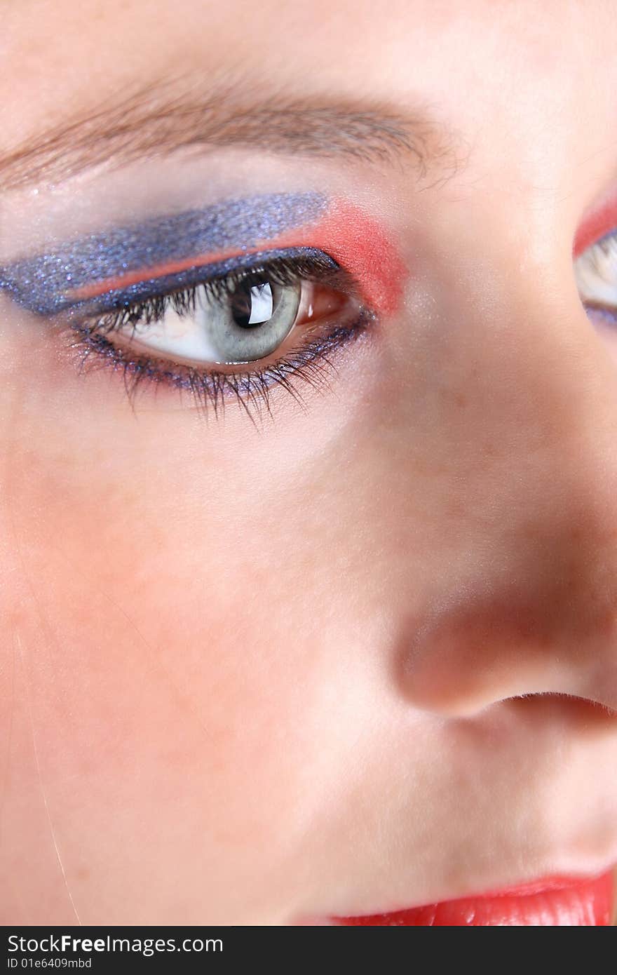 Close up of female model with heavy make up and blue eyes